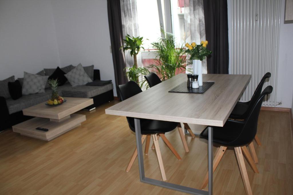 a living room with a table and a couch at Apartment Schiller in Lörrach