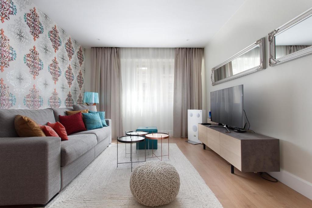 Televízia a/alebo spoločenská miestnosť v ubytovaní Passeig de Gracia Apartment