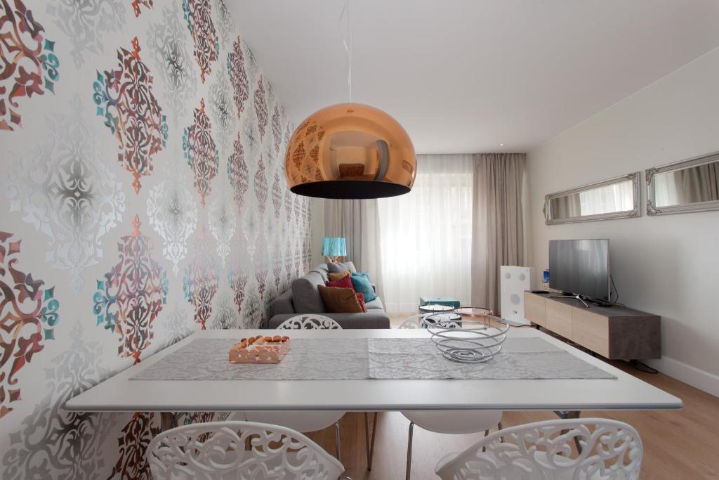 Televízia a/alebo spoločenská miestnosť v ubytovaní Passeig de Gracia Apartment