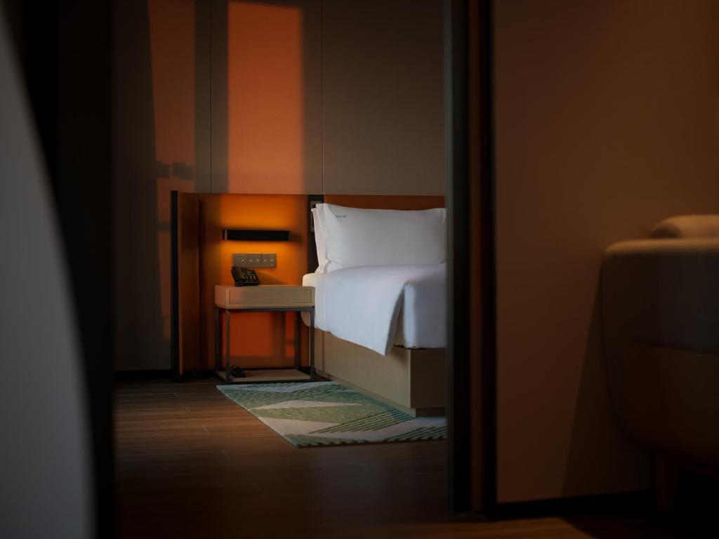 Postel nebo postele na pokoji v ubytování Holiday Inn Quanzhou Donghai by IHG