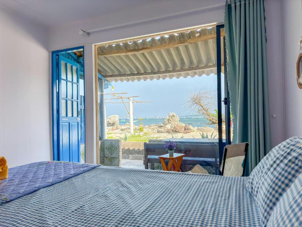 Ένα ή περισσότερα κρεβάτια σε δωμάτιο στο Long Vĩ hotel - đảo Phú Quý