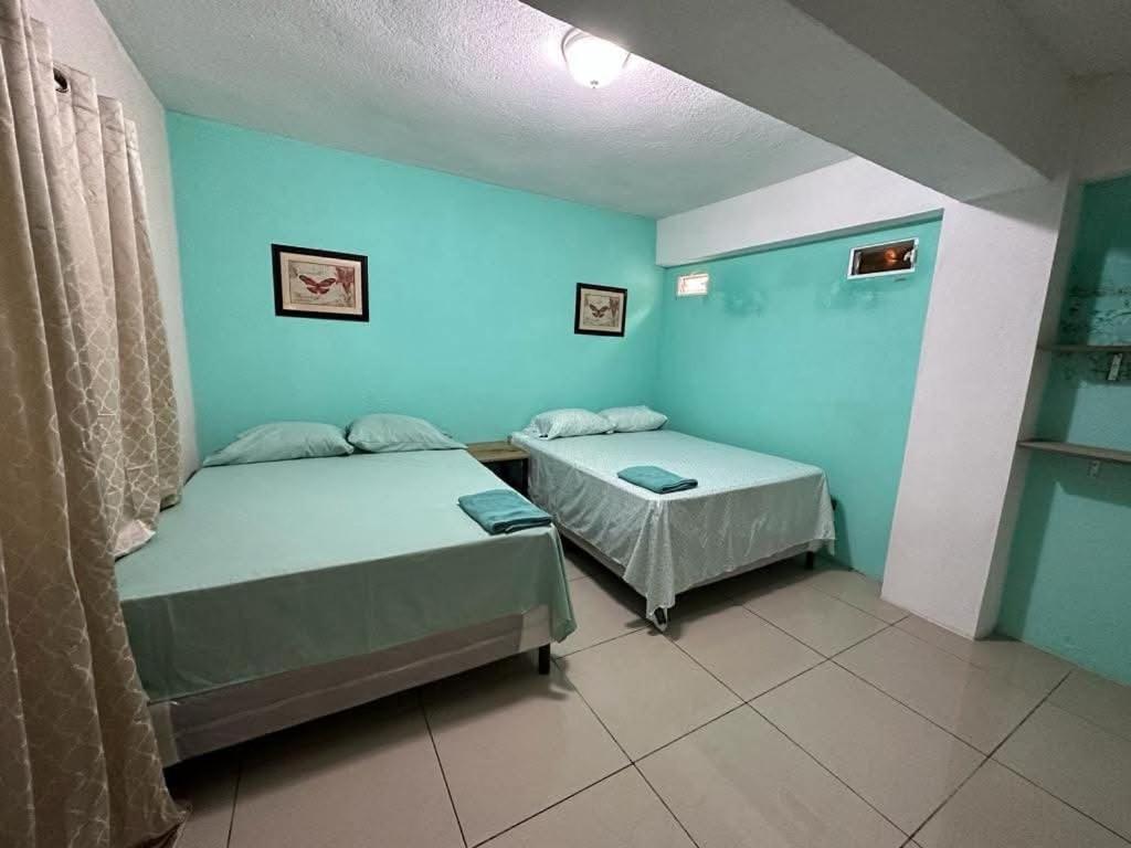Katil atau katil-katil dalam bilik di Apartamentos Small Ville