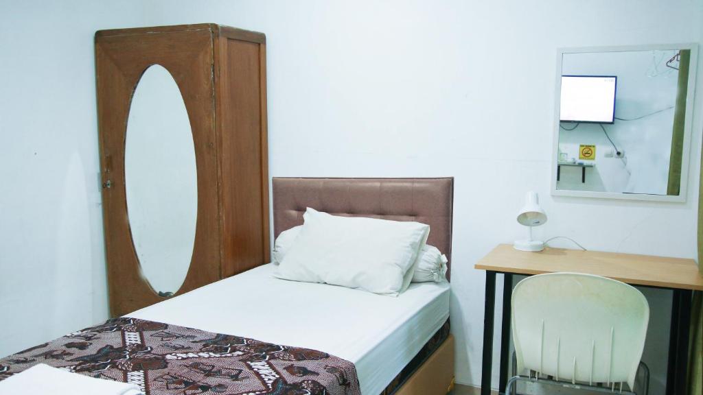 Postel nebo postele na pokoji v ubytování Andelis Homestay