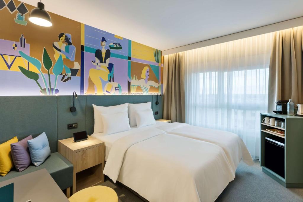 Rúm í herbergi á Spark by Hilton Vienna Donaustadt
