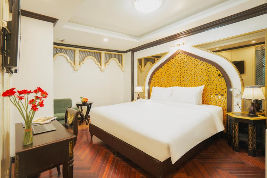 Postel nebo postele na pokoji v ubytování Hotel Du Palace