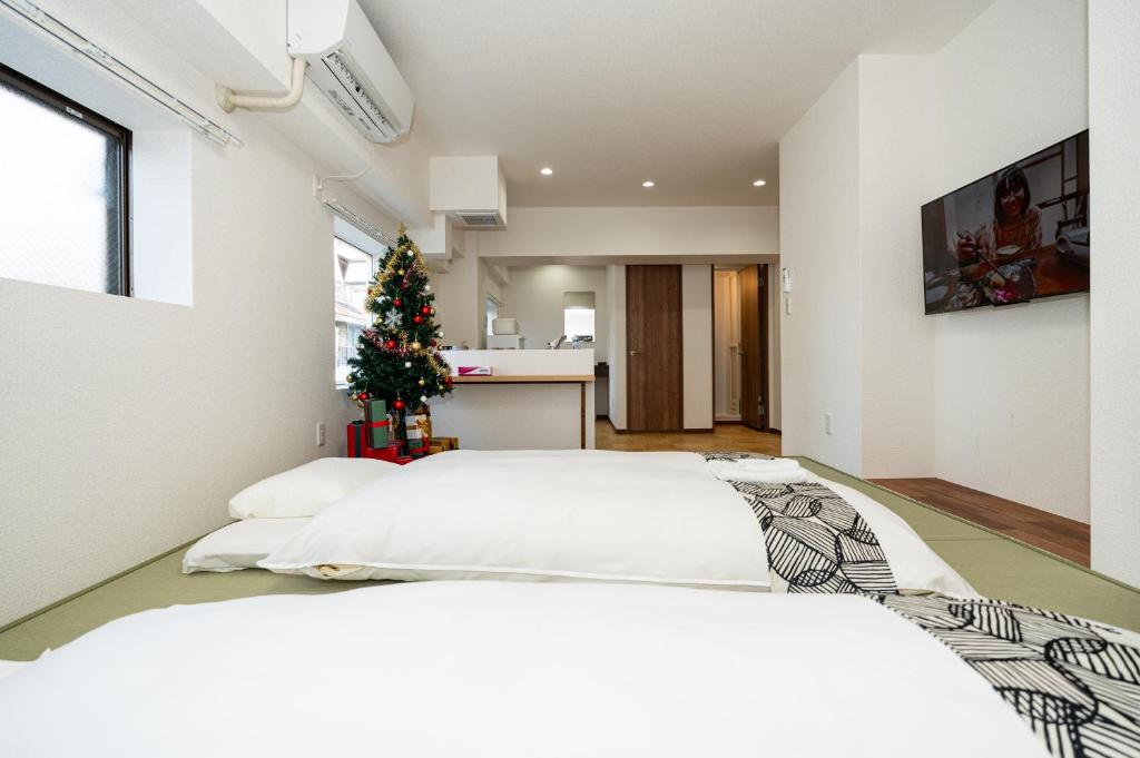 Postel nebo postele na pokoji v ubytování OHAYO AN asakusa