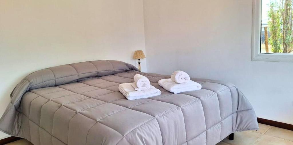 Ένα ή περισσότερα κρεβάτια σε δωμάτιο στο AM Studio Calafate