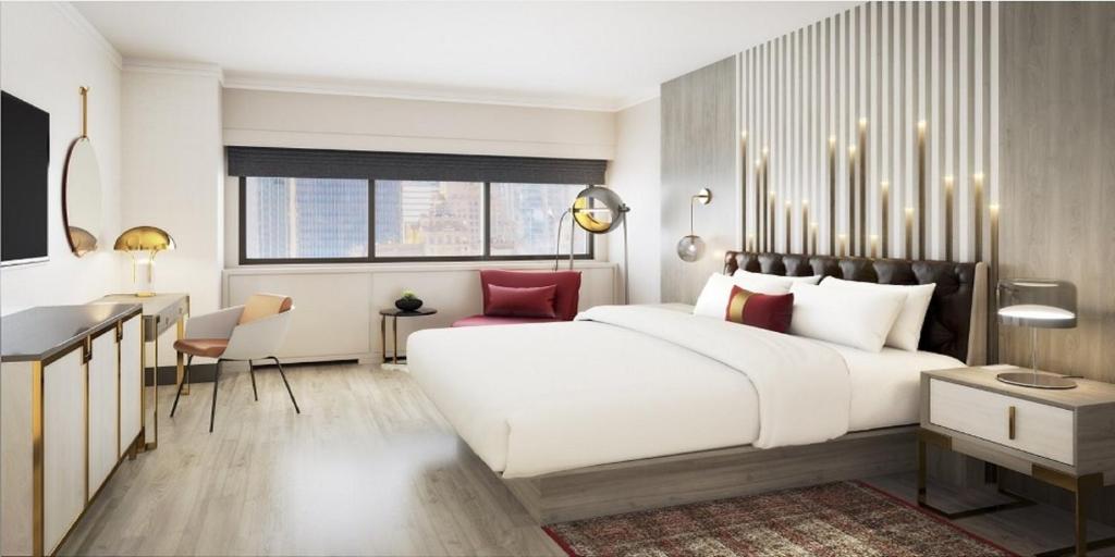 Uma cama ou camas num quarto em The Manhattan at Times Square