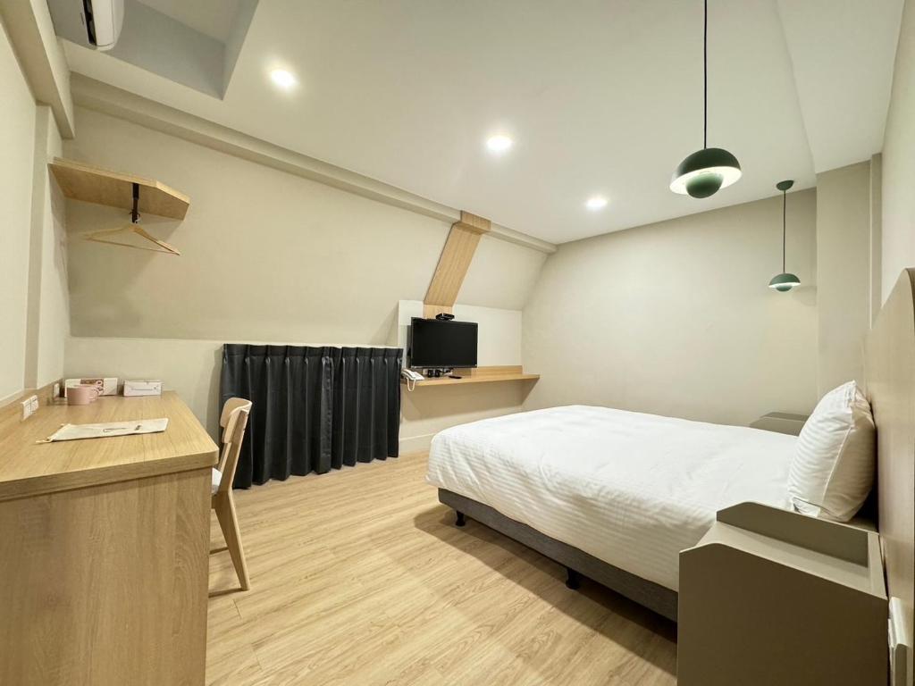 Letto o letti in una camera di Yoshi Hotel - Tainan Sinmei Branch