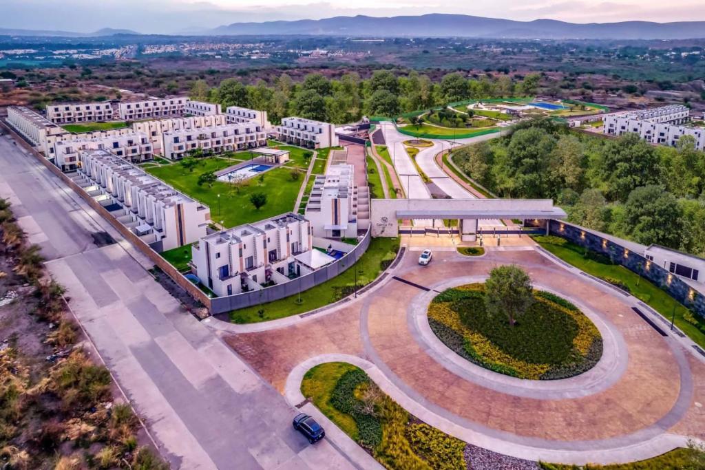 an aerial view of a city with buildings at Casa Moderna con Alberca en Morelos in Xochitepec