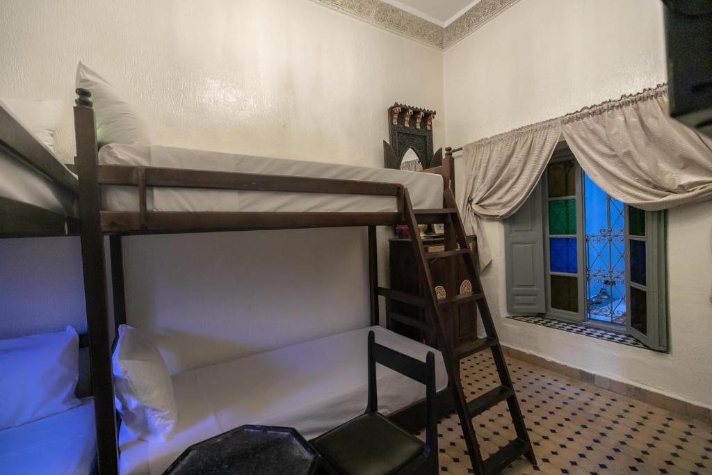 Postel nebo postele na pokoji v ubytování Riad Nayum