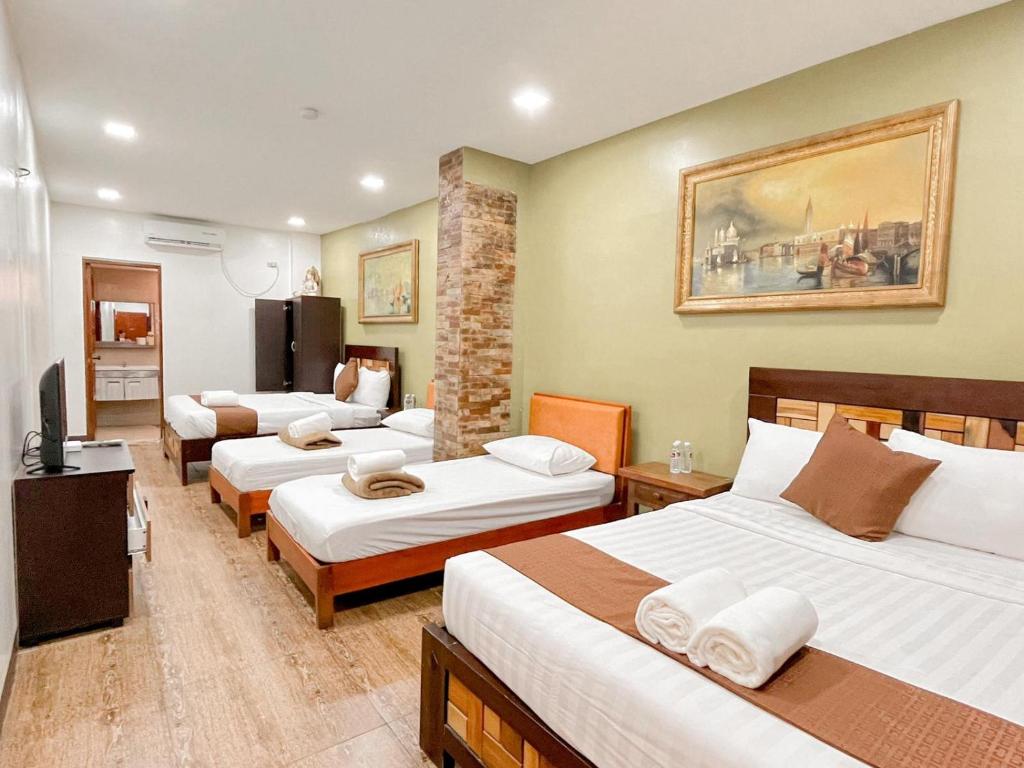 Postel nebo postele na pokoji v ubytování Hortz Hotels And Resorts