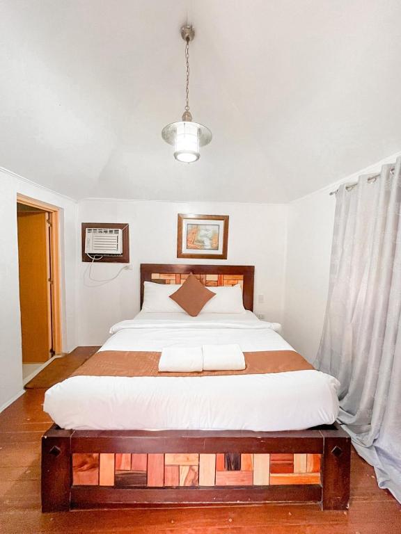 Postel nebo postele na pokoji v ubytování Hortz Hotels And Resorts