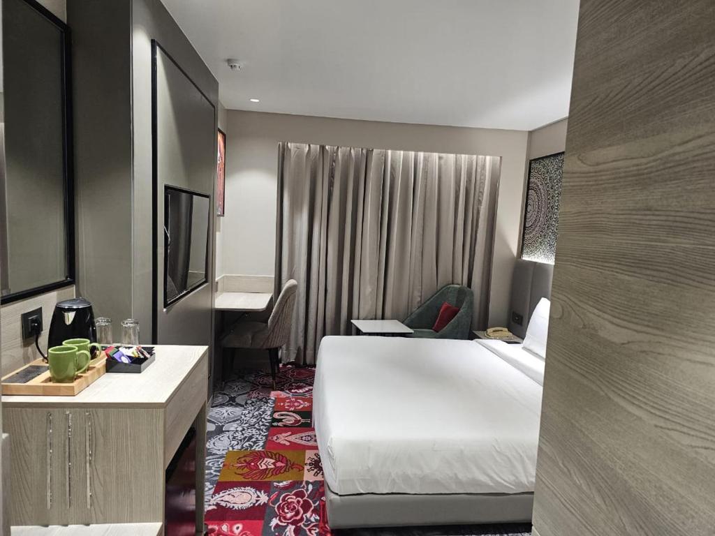 Postel nebo postele na pokoji v ubytování Crystal Inn