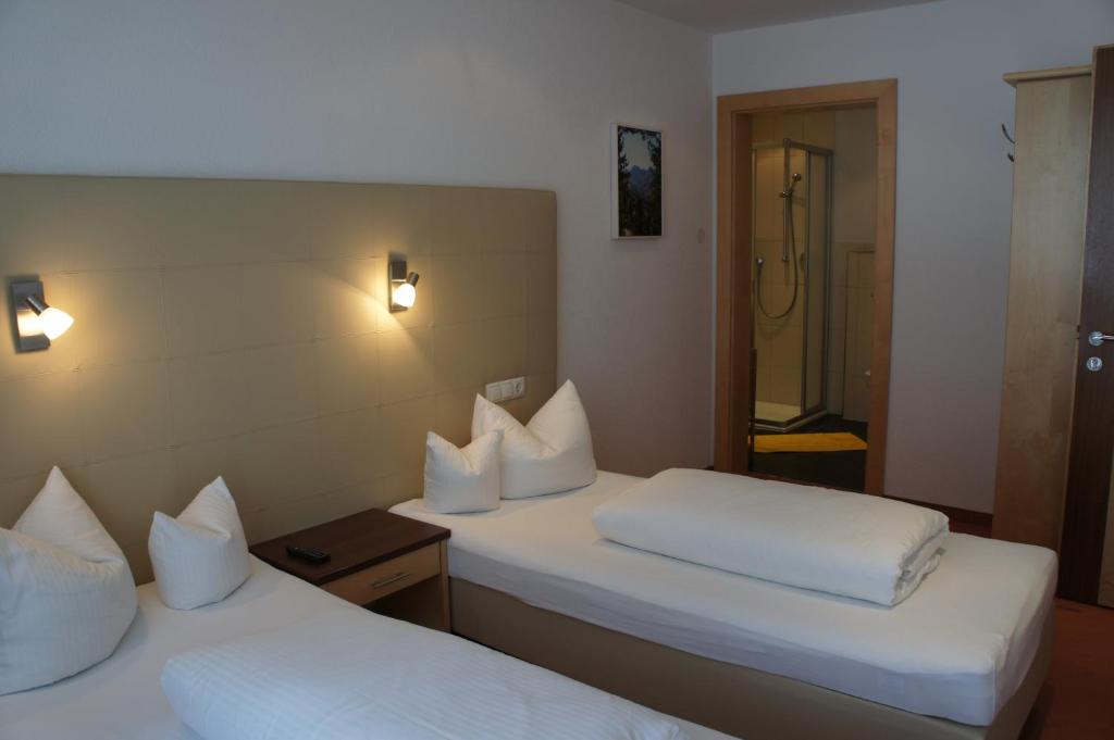Postel nebo postele na pokoji v ubytování alpinea Appartements