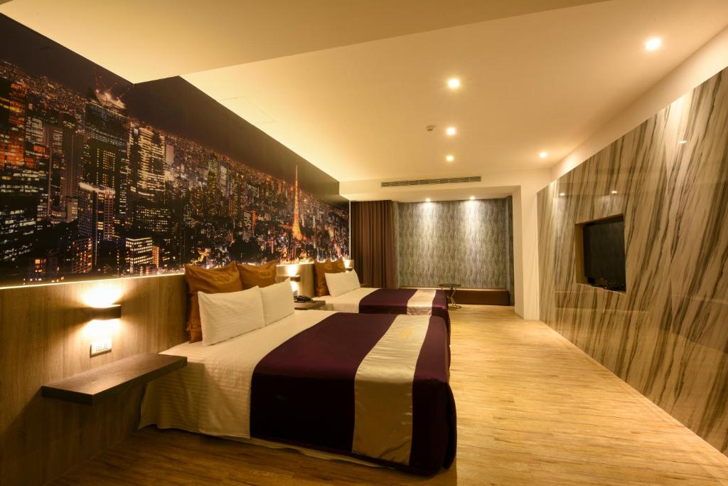 Postel nebo postele na pokoji v ubytování Belle Song Motel