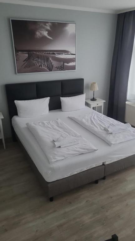 Postel nebo postele na pokoji v ubytování Appartement-Hotel Rostock