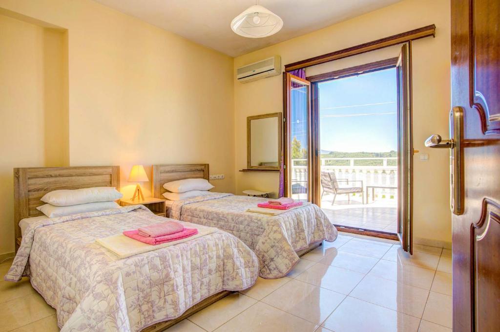 A bed or beds in a room at Zante View villa Athina