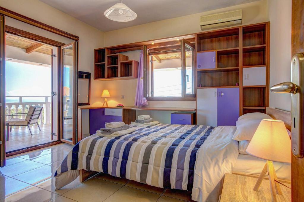 A bed or beds in a room at Zante View villa Athina