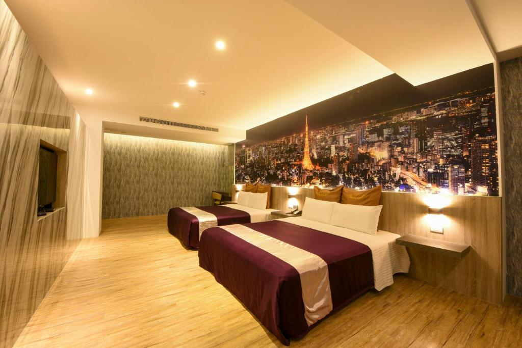 Postel nebo postele na pokoji v ubytování Belle Song Motel