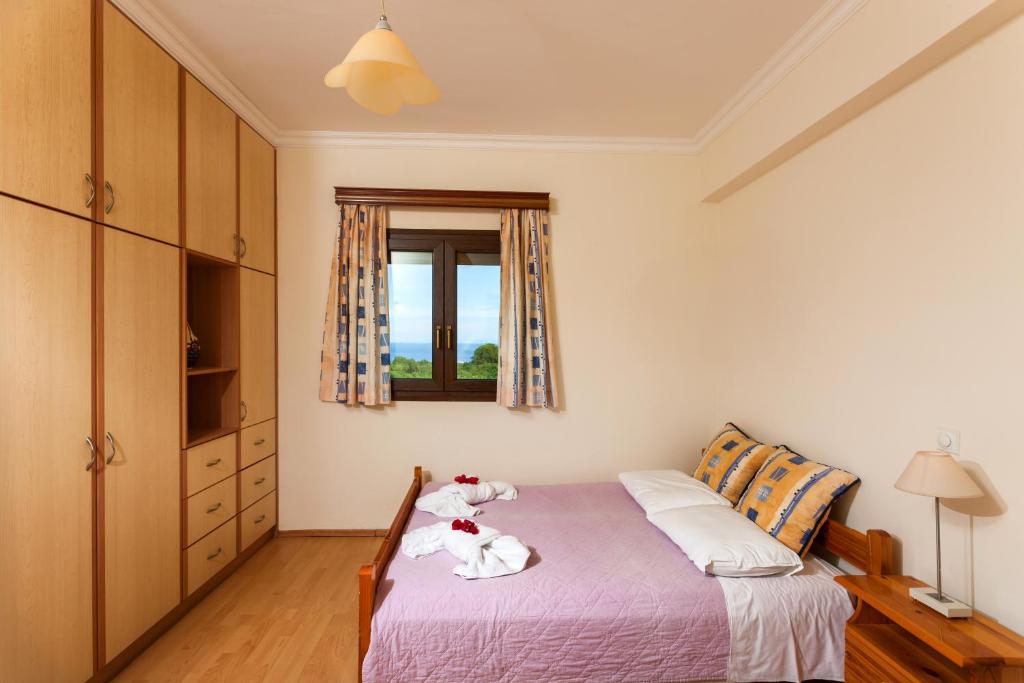 Posteľ alebo postele v izbe v ubytovaní Zante View villa Odysseus