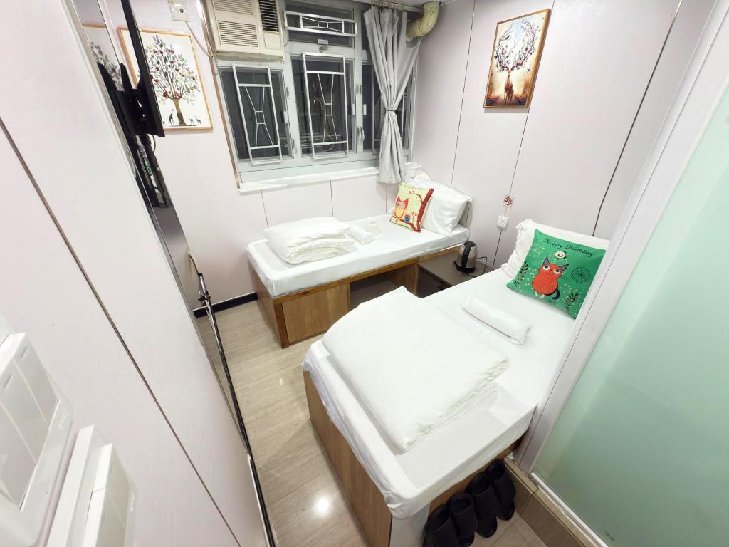 Postel nebo postele na pokoji v ubytování 吉祥賓館 Fortune Inn