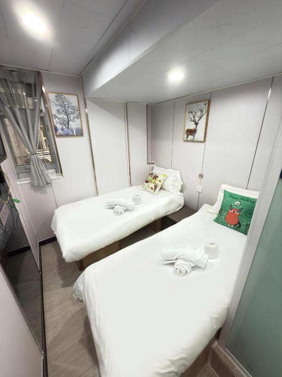 Postel nebo postele na pokoji v ubytování 吉祥賓館 Fortune Inn