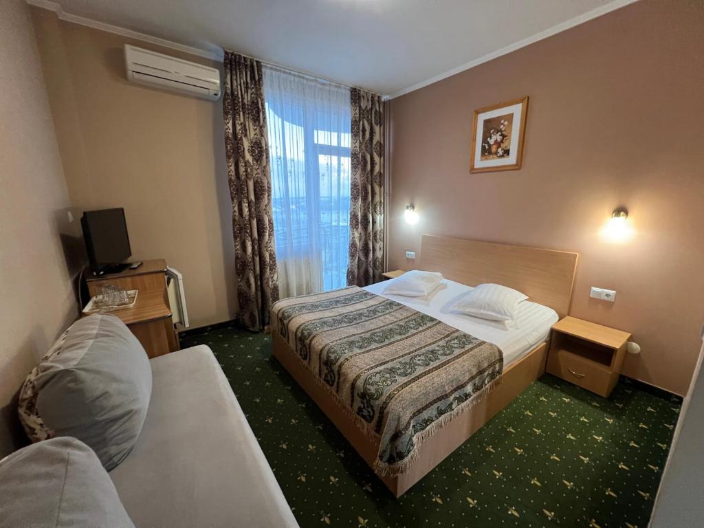 Postel nebo postele na pokoji v ubytování Vila Crinul