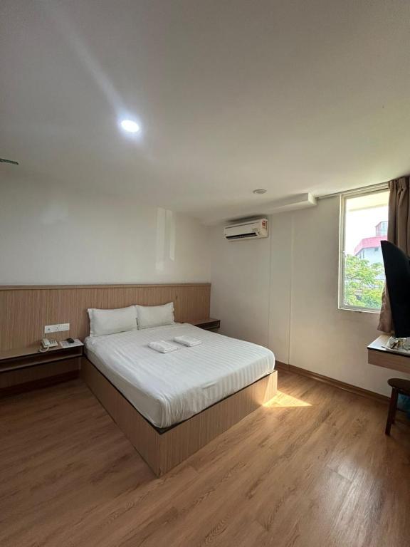 Postel nebo postele na pokoji v ubytování Mint Hotel