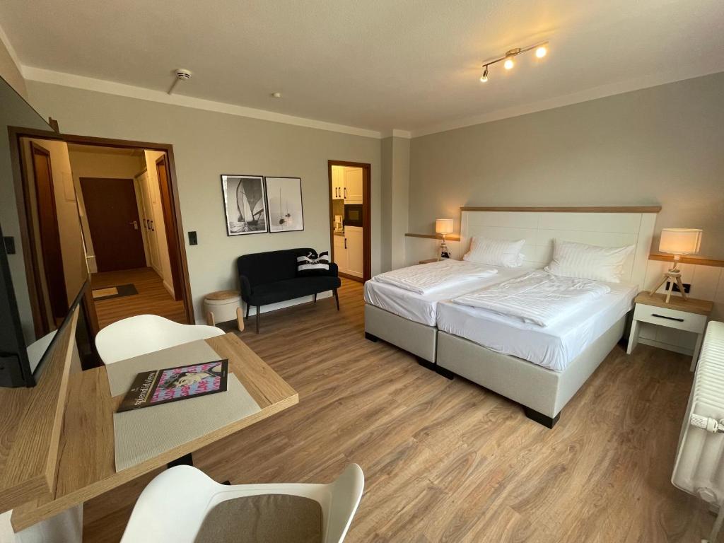 Postel nebo postele na pokoji v ubytování Hotel Royal