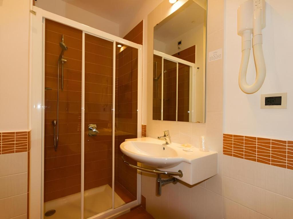Koupelna v ubytování Hotel Serapo