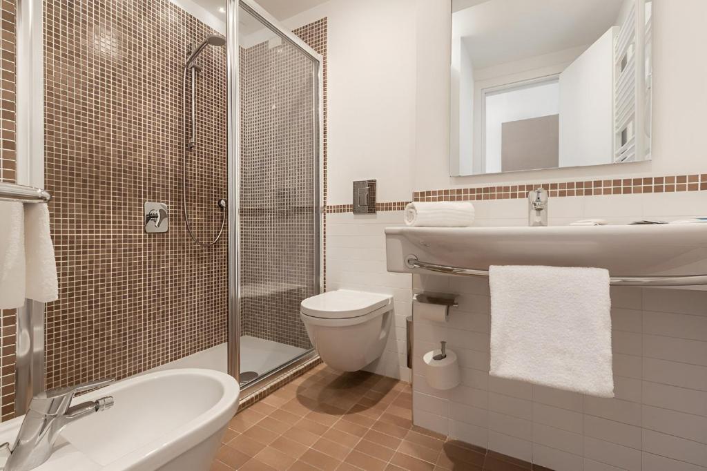 Koupelna v ubytování Hotel Serapo
