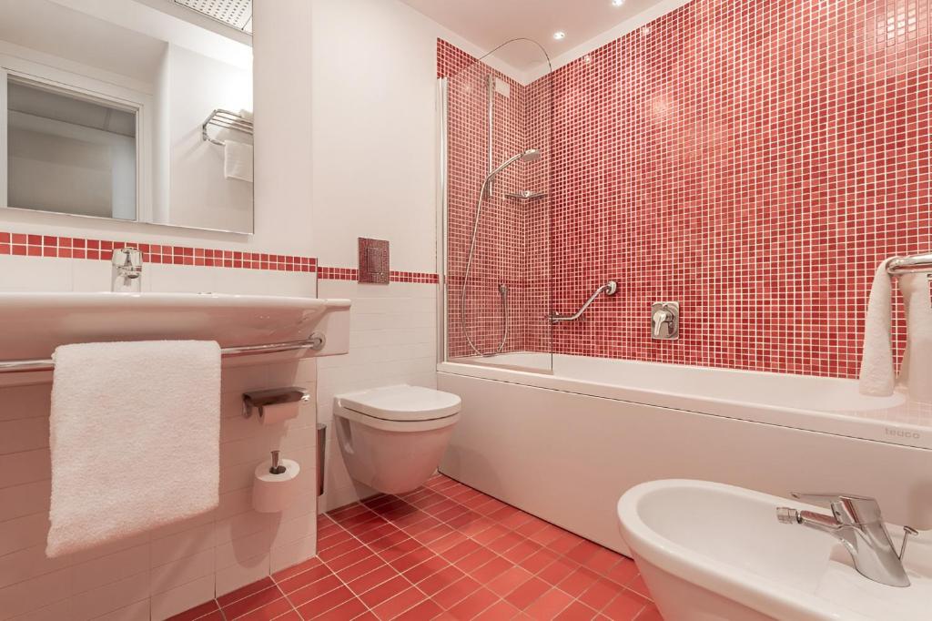 Koupelna v ubytování Hotel Serapo