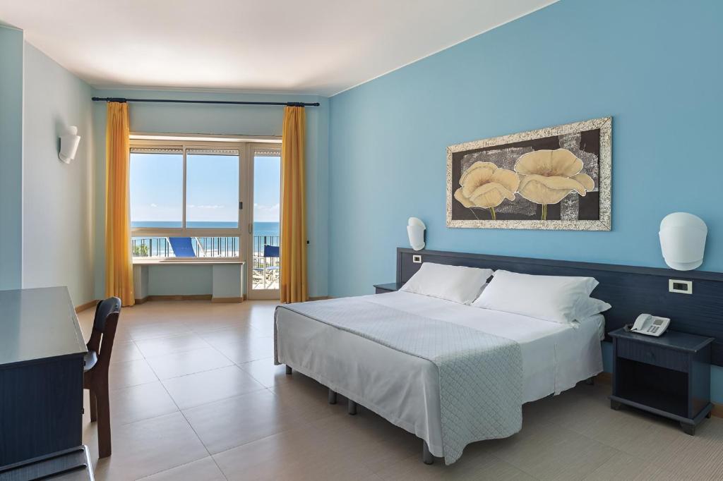 Postel nebo postele na pokoji v ubytování Hotel Serapo