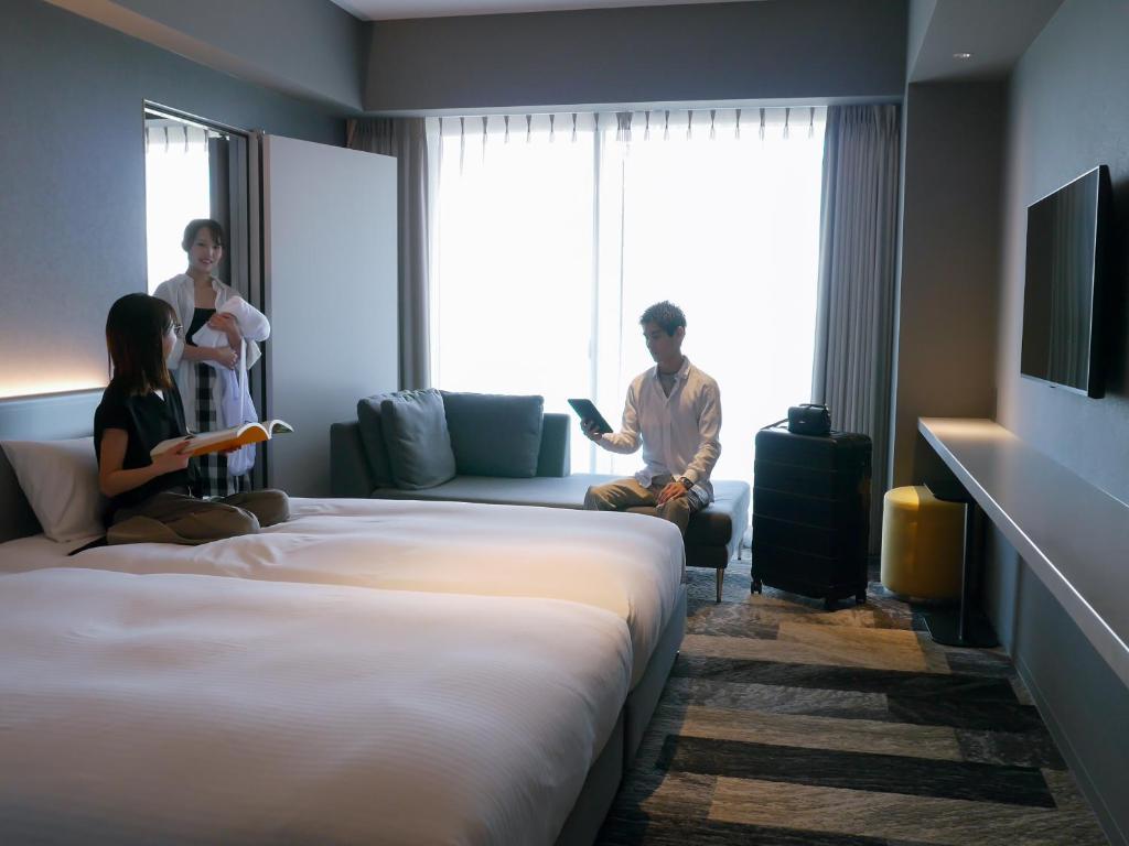 Beachfront asbo stay hotel - Chambre Communicante (2 Chambres Avec Lits Jumeaux)