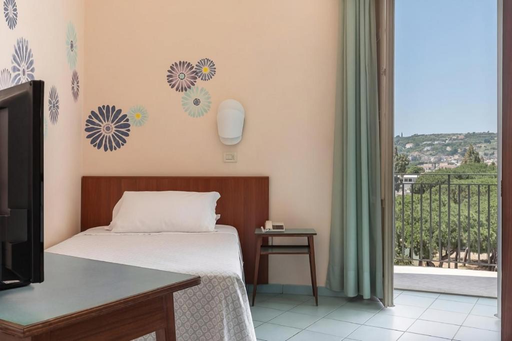Postel nebo postele na pokoji v ubytování Hotel Serapo