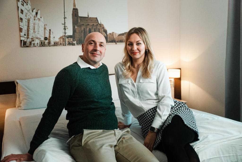 Postel nebo postele na pokoji v ubytování Wellness penzion U GIGANTU