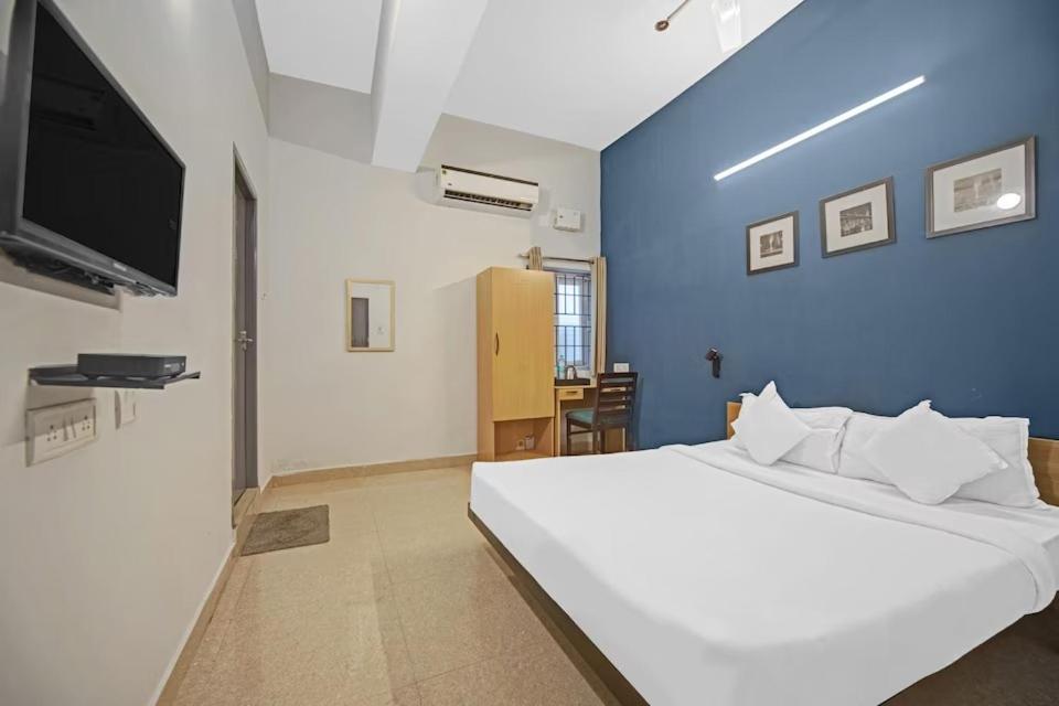 Postel nebo postele na pokoji v ubytování Hotel Sadha Siva