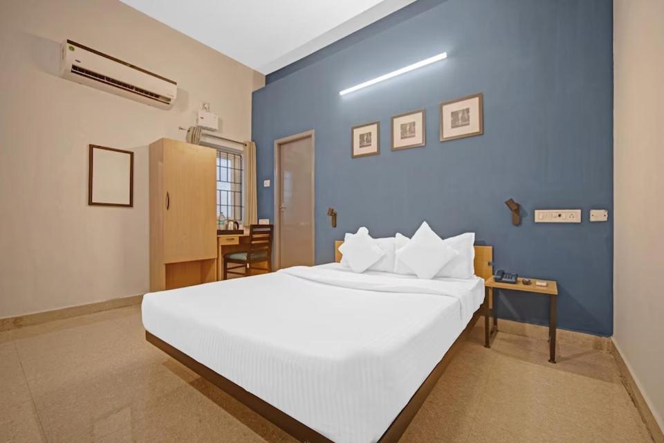 Postel nebo postele na pokoji v ubytování Hotel Sadha Siva