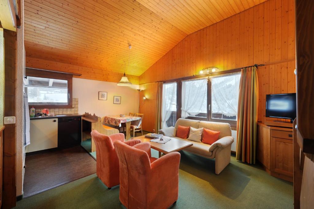 TV a/nebo společenská místnost v ubytování Serviced Apartments – Kirchbühl@home