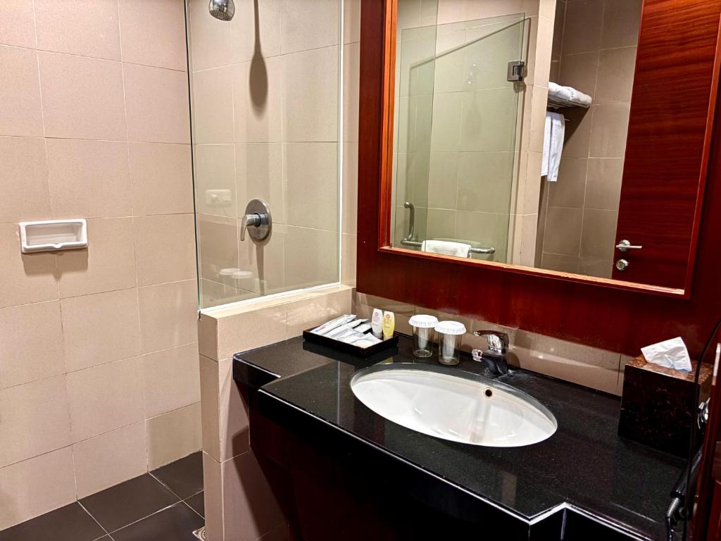 Koupelna v ubytování Manado Quality Hotel