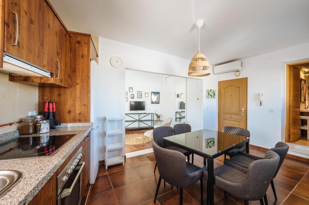 A kitchen or kitchenette at HomeySeville-Lovely Duplex at Santa Cruz 10 pax, Parking Optional