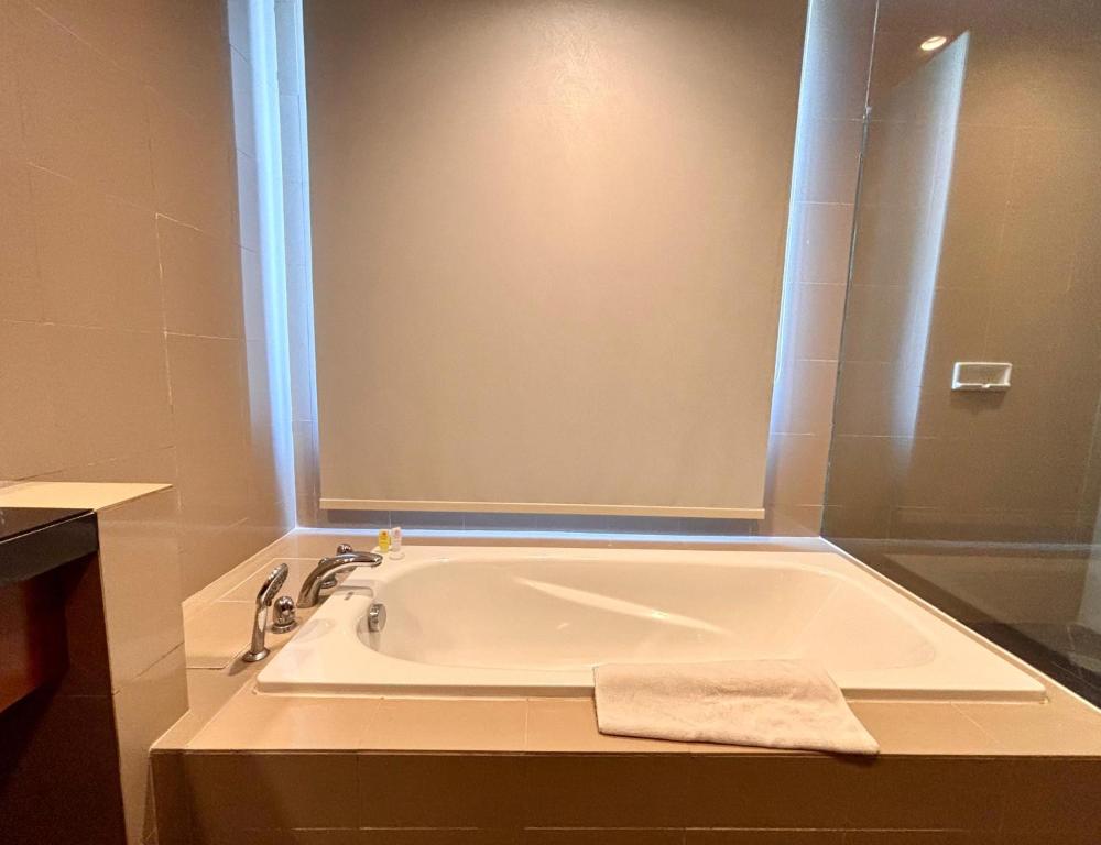 Koupelna v ubytování Manado Quality Hotel