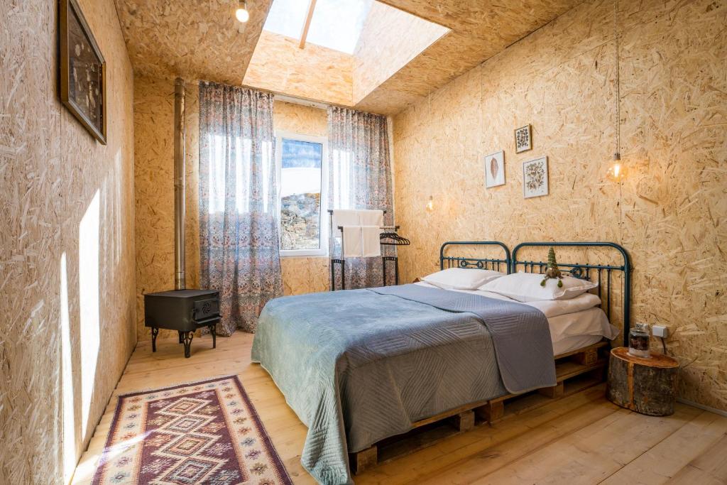 Postel nebo postele na pokoji v ubytování Agra Ushguli