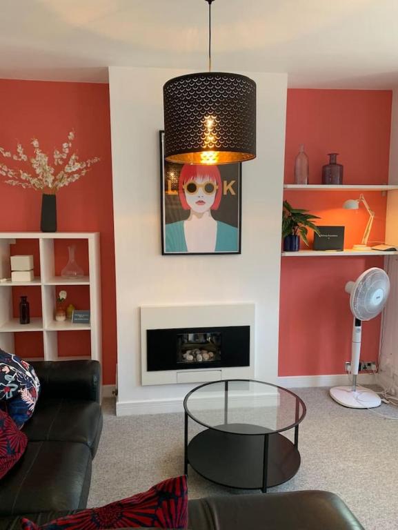 a living room with a couch and a glass table at 3 Bed Family House Free Parking in Southend-on-Sea