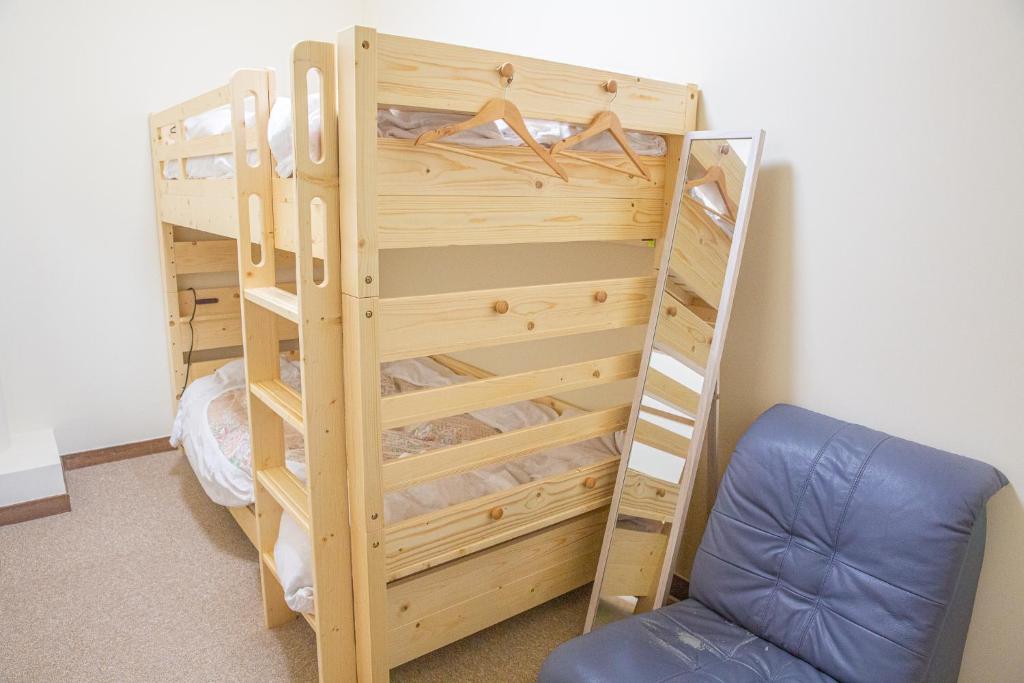 Postel nebo postele na pokoji v ubytování バードランド