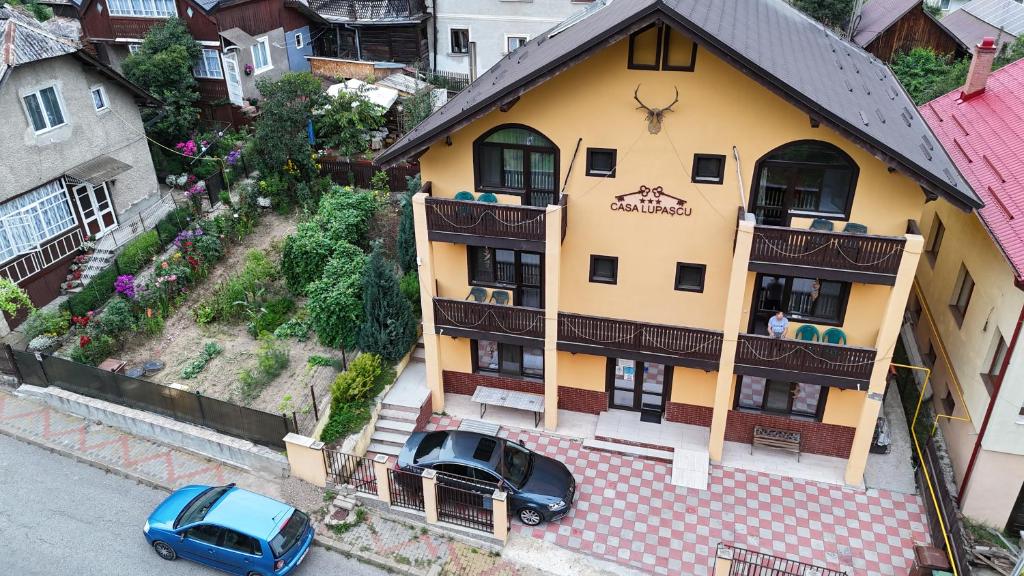 an overhead view of a building with cars parked in front at Casa Lupascu in Vatra Dornei