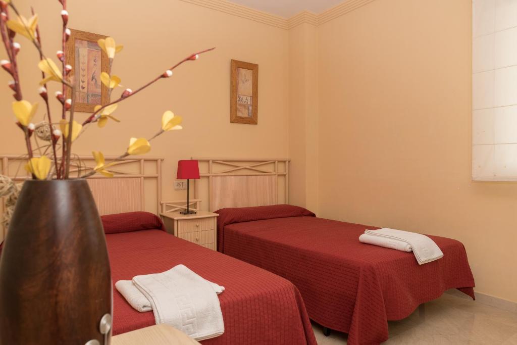 Posteľ alebo postele v izbe v ubytovaní Apartamento 305