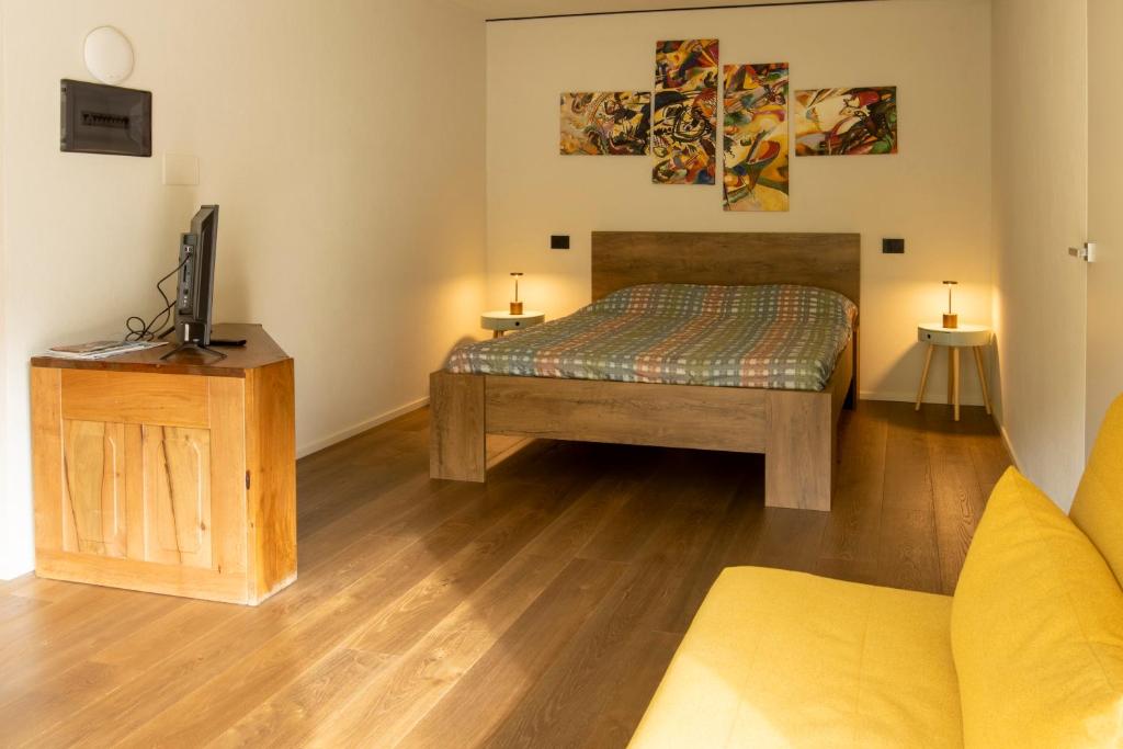Postel nebo postele na pokoji v ubytování Little Paradise - Ampio Monolocale