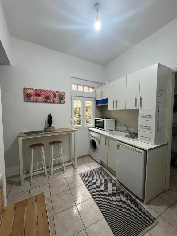 Kuchyň nebo kuchyňský kout v ubytování Istos Apartment
